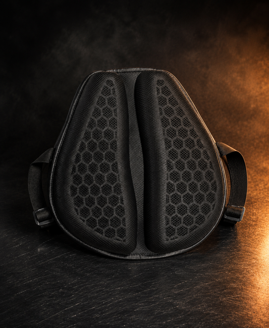 GelAura honeycomb gel motorcycle seat cushion, premium dark studio shot with amber lighting